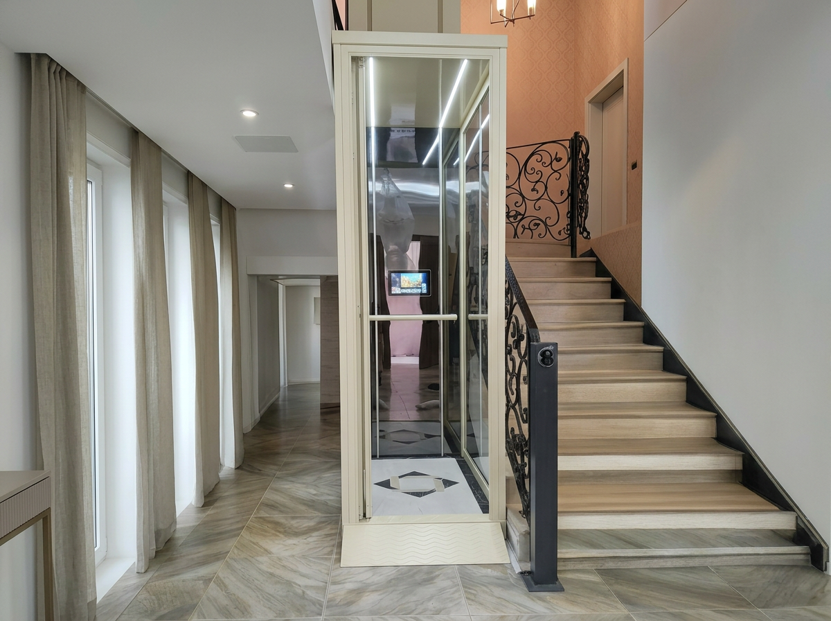 White shaftless home lift installed in staircase, home elevator without pit